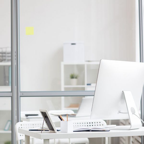 Workplace of modern manager with computer monitor and office supplies